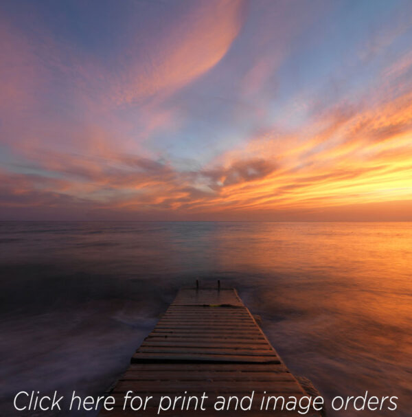Mediterranean sunset is photographed from a jetty in Sicily Adrian Houston colour sky sea photography