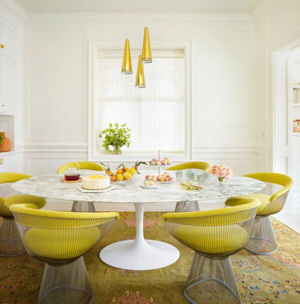 Annie Schlechter, nobody, interior, indoors, Summer Thornton, modern, contemporary, dining room, colour, white, yellow and white, wall covering, panelling, seating, chair, dining chair, table, dining table, round table, metal, soft furnishing, rug, patterned, floral, pattern, lighting, ceiling light, pendant light, objects, food, retro, vintage, glamour, vibrant,