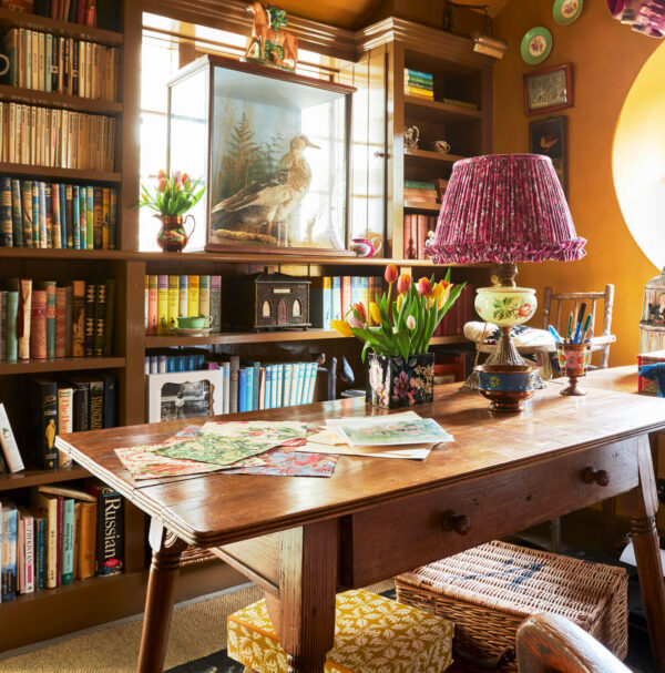 Boz Gagovski, Emma Burns, Alexandra Tolstoy, nobody, interior, indoors, Colefax & Fowler, traditional, country, cottage, study, home office, colour, yellow, table, desk, writing desk, lighting, lamp, table lamp, storage, shelving, built-in shelving, wall-to-wall shelving, antique furniture, objects, vintage, creativity, individuality, inspiration, fresh, colourful, vibrant colour, bold,