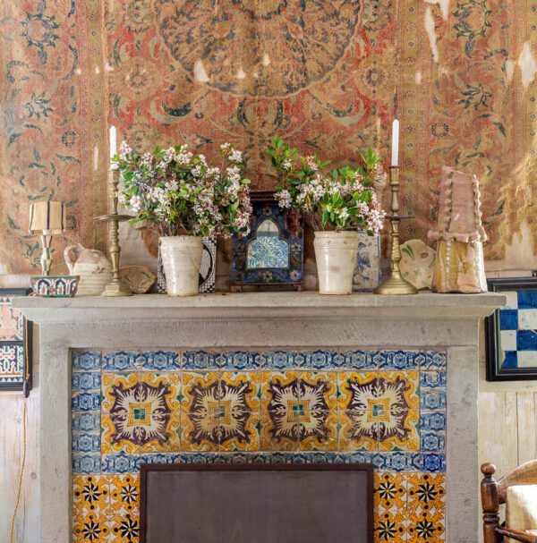 Mark Luscombe-Whyte, Umberto Pasti, Moroccan, nobody, interior, indoors, traditional, sitting room, detail, fireplace, mantelpiece, stone, tile, ceramic tile, textile, objects, houseplant, candlestick, artwork, ceramics, display, craftsmanship, texture, vintage, creativity, individuality, ethnic, eclectic, rustic, Islamic, cluttered, theatrical, reclaimed,