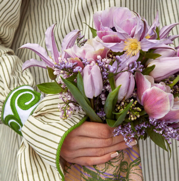 Simon Brown, person, female, hand, exterior, outdoors, floral arrangement, spring, flower, colour, purple, pink, clematis, tulip, tulipa, syringa, lilac, striped, fabric,